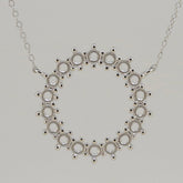 Sterling silver semi mount pendant setting with loops for multi stones and an 18" chain, featuring white topaz.